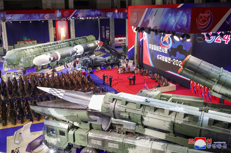 North Korean leader Kim Jong Un (C, on podium) attending an opening ceremony for the National Defence Development-2024 exhibition in Pyongyang on Nov. 21, 2024.